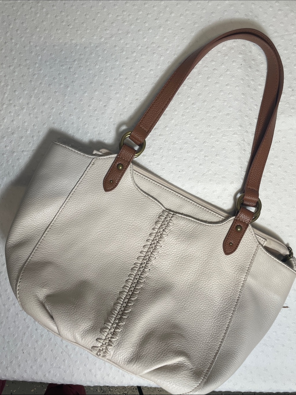 The Sak Bolinas Leather Tote taupe woven center seam leather shoulder straps.